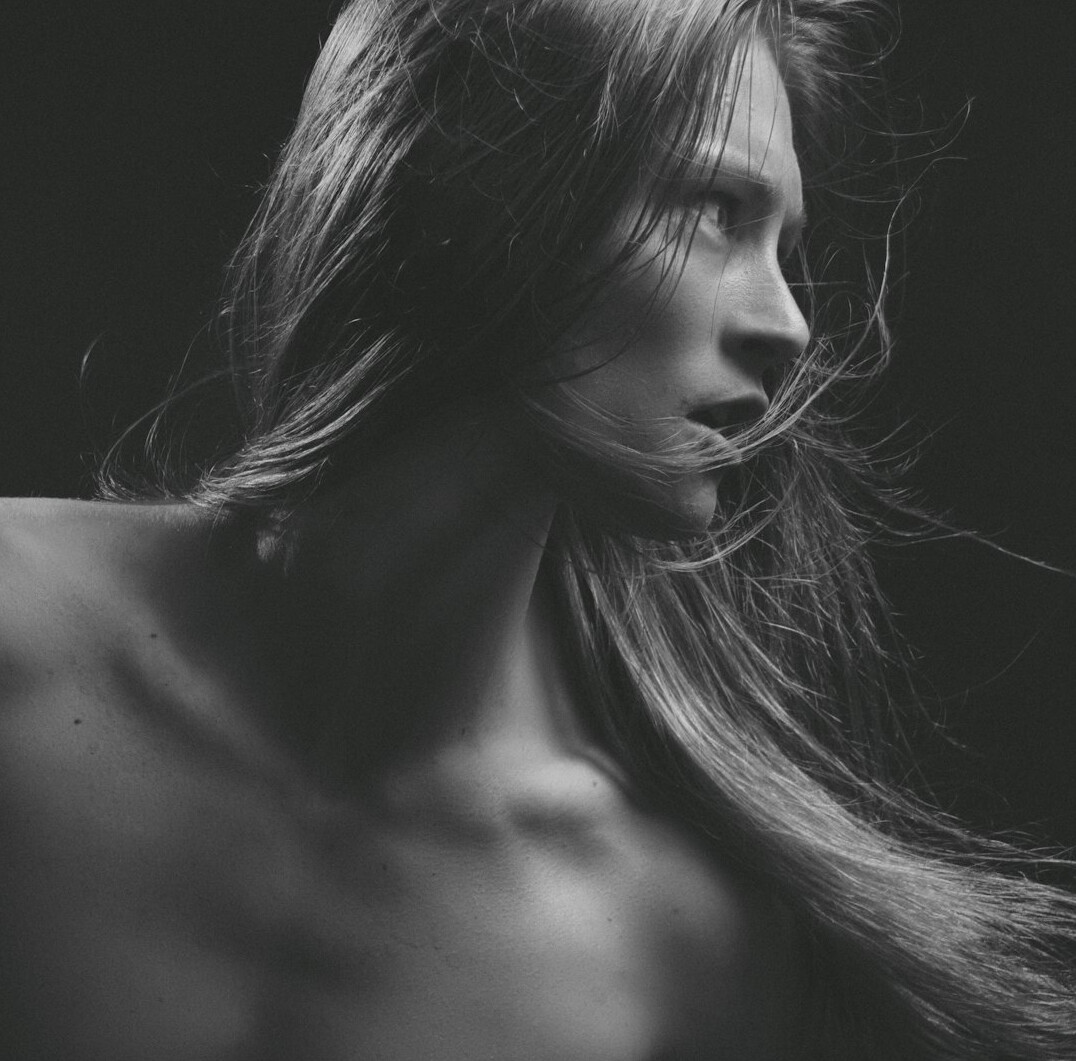 Studio portrait of a woman with long straight hair